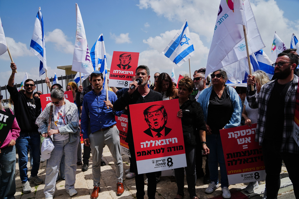 Residents of northern Israel living near the Lebanese border protest the security situation, outside the U.S. Embassy in Jerusalem Sunday, April 19, 2026. Hebrew on a sign bearing an image of President Trump reads "Hezbollah thanks Trump." (AP Photo/Mahmoud Illean)