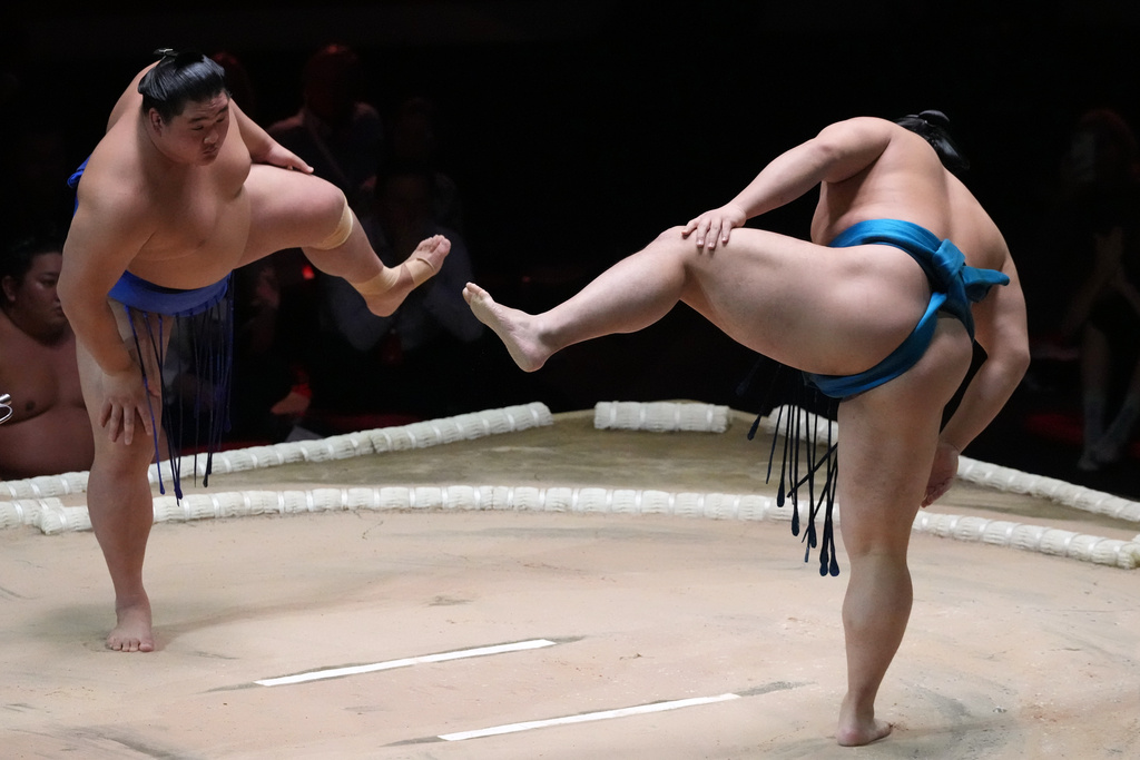 Sumo wrestlers, called rikishi, Kotoeiho and Oshoumi, left, prepare for their bout during The Grand Sumo Tournament at the Royal Albert Hall in London, Wednesday, Oct. 15, 2025.(AP Photo/Frank Augstein)
