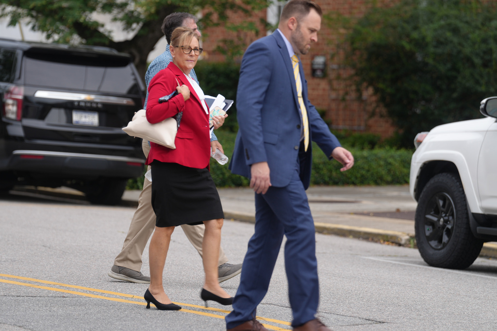 Sen. Darline Graham, R-S.C., walks across a street to a television studio for a debate with four other Republicans competing in a special Senate primary to replace her brother, Sen. Lindsey Graham, R-S.C., on Monday, Aug. 3, 2026, in Columbia, S.C. (AP Photo/Meg Kinnard)