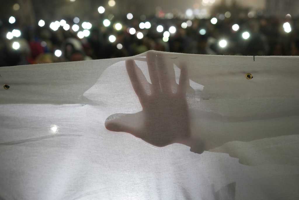 FILE - Students march on New Years Eve during a protest that erupted after a concrete canopy fell two months ago, in Belgrade, Serbia, Dec. 31, 2024. (AP Photo/Darko Vojinovic, File)