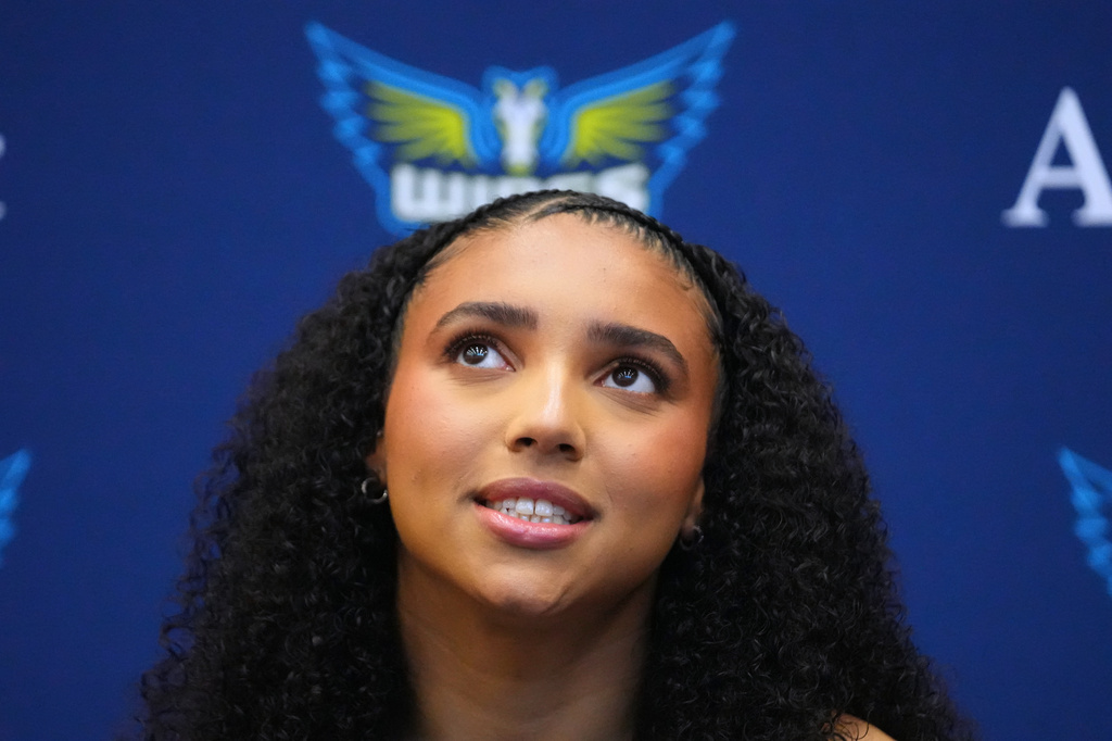Dallas Wings' Azzi Fudd talks to reporters during the team's WNBA basketball media day Monday, April 27, 2026, in Arlington, Texas. (AP Photo/Julio Cortez)
