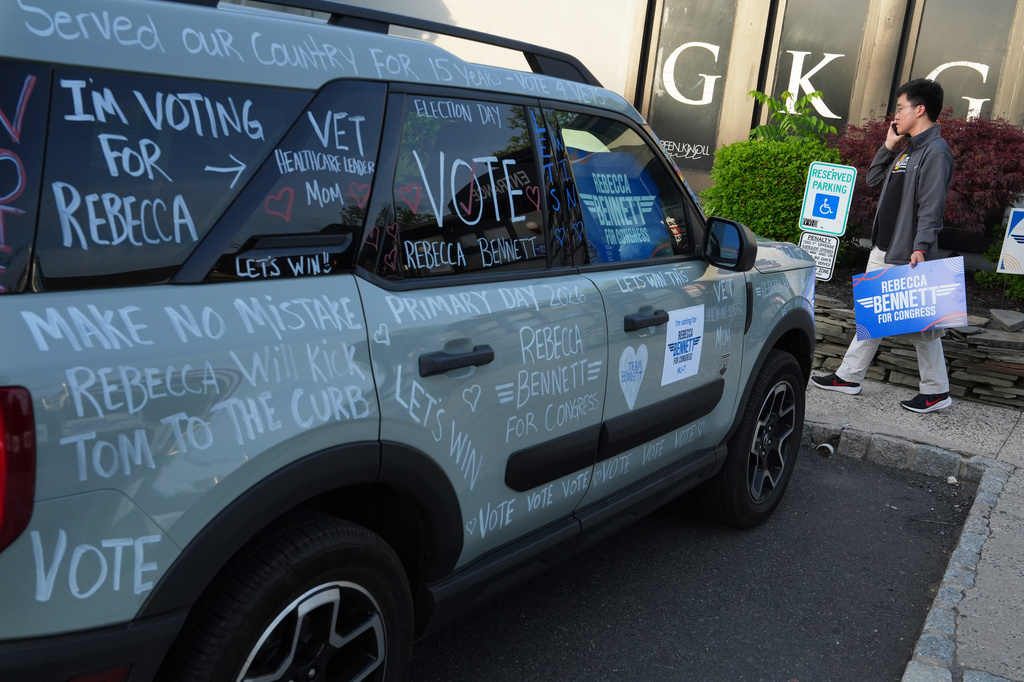 Voting messages are displayed on a car at a primary election night watch party for Rebecca Bennett, Democratic candidate for New Jersey's 7th Congressional District, Tuesday, June 2, 2026, in Bridgewater, N.J. (AP Photo/Ryan Murphy)