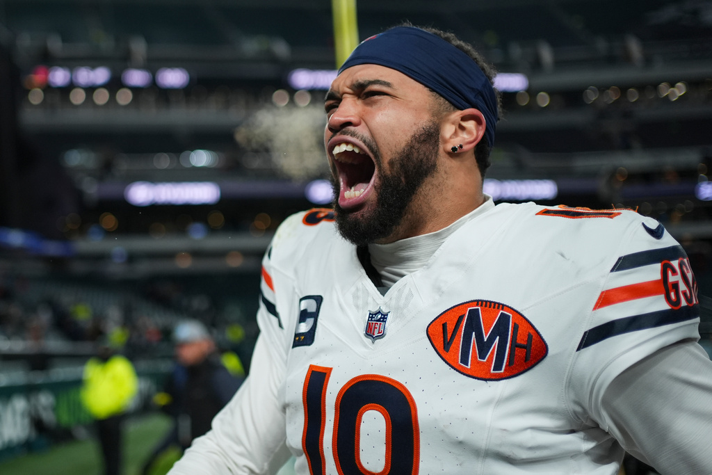 Chicago Bears quarterback Caleb Williams (18) celebrates his team's win over the Philadelphia Eagles in an NFL football game, Friday, Nov. 28, 2025, in Philadelphia. (AP Photo/Matt Slocum)
