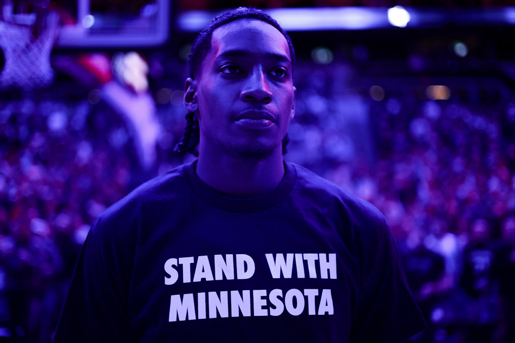Minnesota Timberwolves guard Rob Dillingham looks on during the national anthem prior to an NBA basketball game against the Oklahoma City Thunder, Thursday, Jan. 29, 2026, in Minneapolis. (AP Photo/Matt Krohn)