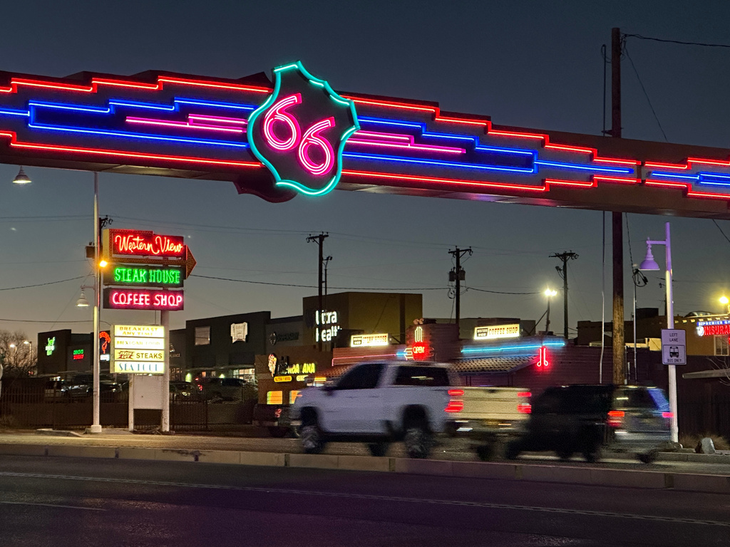 Traffic passes under a neon Route 66 sign on the west end of Albuquerque, New Mexico, Friday, Jan. 16, 2026. (AP Photo/Susan Montoya Bryan)