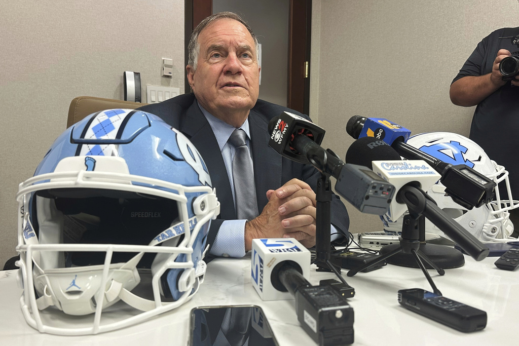 FILE - North Carolina coach Bill Belichick speaks with a group of reporters during the Atlantic Coast Conference's NCAA college football media days, Thursday, July 24, 2025, in Charlotte, N.C. (AP Photo/Aaron Beard, File)
