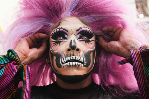 Drag artist Angel Arum fits his wig for the Day of the Dead Catrina parade in Mexico City, Sunday, Oct. 26, 2025. (AP Photo/Claudia Rosel) Drag artist Angel Arum fits his wig for the Day of the Dead Catrina parade in Mexico City, Sunday, Oct. 26, 2025. (AP Photo/Claudia Rosel)