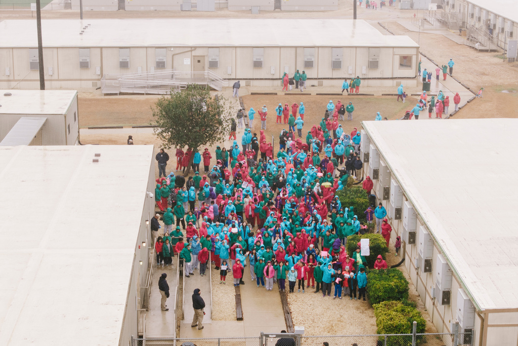 FILE - Detainees held at the South Texas Family Residential Center wave signs during a demonstration in Dilley, Texas, Saturday, Jan. 24, 2026. (AP Photo/Brenda Bazán, File)