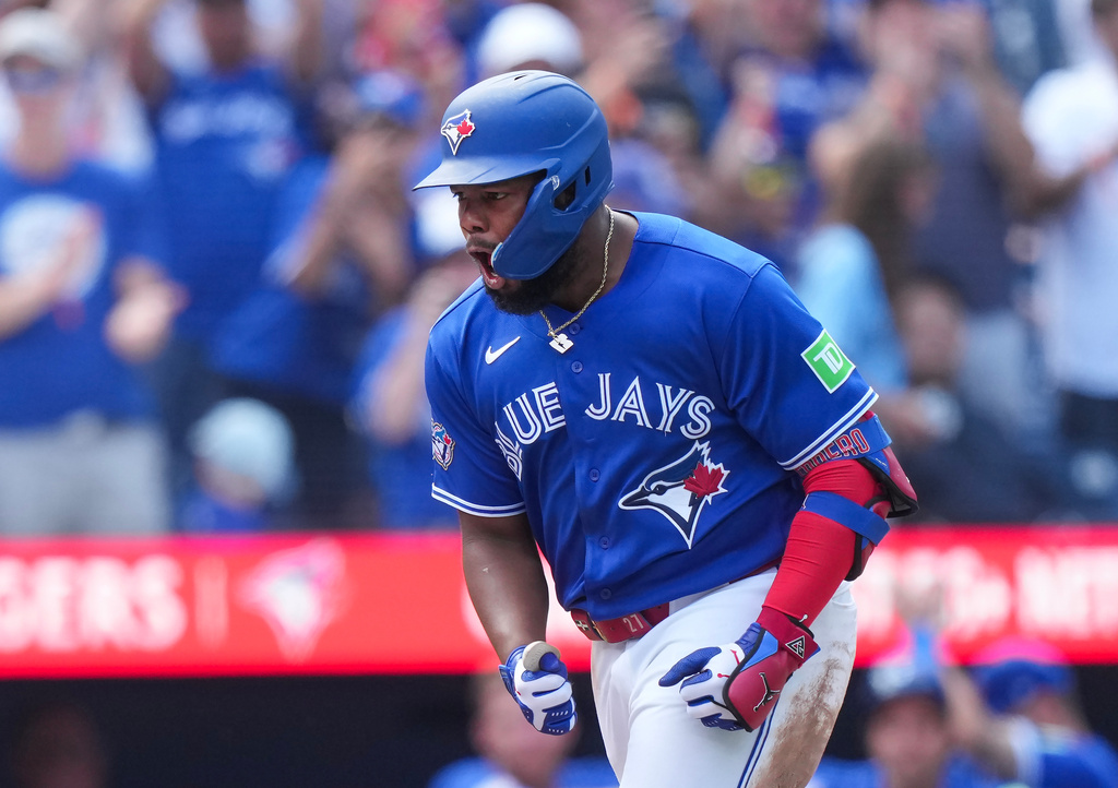 Toronto Blue Jays' Vladimir Guerrero Jr. reacts after hitting a solo home run against the Baltimore Orioles during the fifth inning of a baseball game in Toronto, Sunday, Sept. 13, 2026. (Nathan Denette/The Canadian Press via AP)