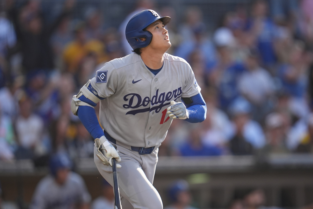Los Angeles Dodgers' Shohei Ohtani watches his home run during the first inning of a baseball game against the San Diego Padres Wednesday, May 20, 2026, in San Diego. (AP Photo/Gregory Bull)