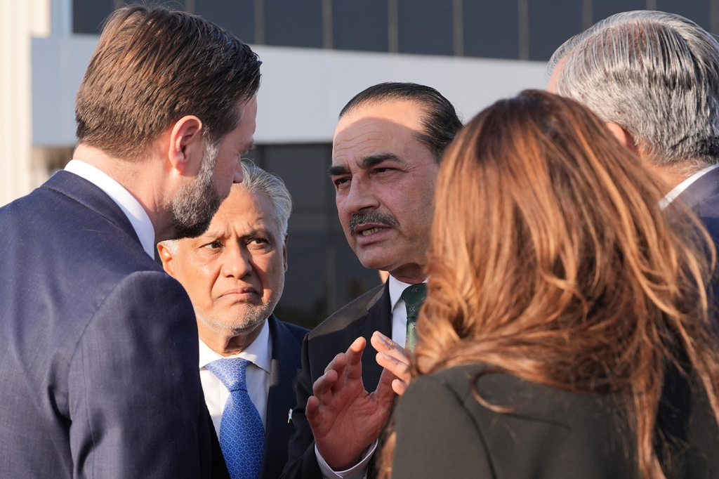 Vice President JD Vance, left, talks to Pakistan's Chief of Defence Forces and Chief of Army Staff Field Marshall Asim Munir, right, and Pakistani Deputy Prime Minister and Foreign Minister Mohammad Ishaq Dar, center, before boarding Air Force Two after attending talks on Iran in Islamabad, Pakistan, Sunday, April 12, 2026. (AP Photo/Jacquelyn Martin, Pool)