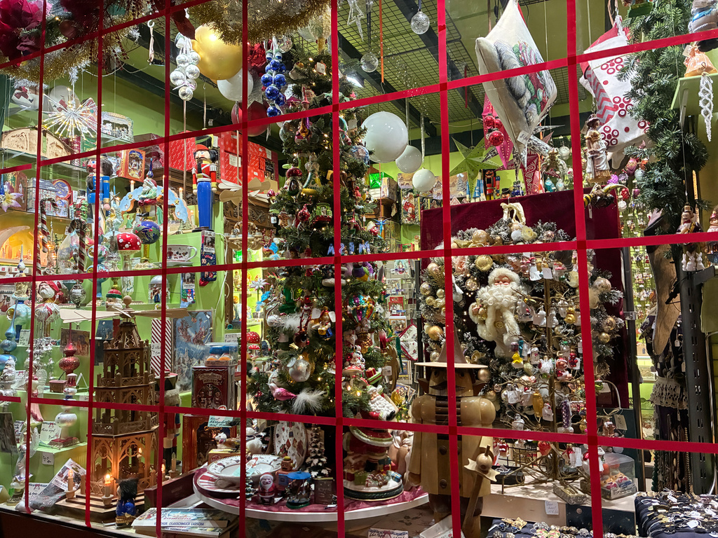 Holiday ornaments are seen through the window of the Christel Dauwe Collection ornaments shop in Antwerp, Belgium, Saturday, Dec. 6, 2025. (AP Photo/Virginia Mayo)