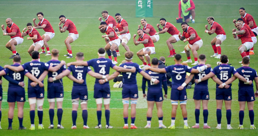 Tonga's players, rear, perform the Sipi tau ahead of the Quilter Nations Series Rugby match between Scotland and Tonga in Edinburgh, Scotland, Sunday, Nov. 23, 2025. (Jane Barlow/PA via AP)