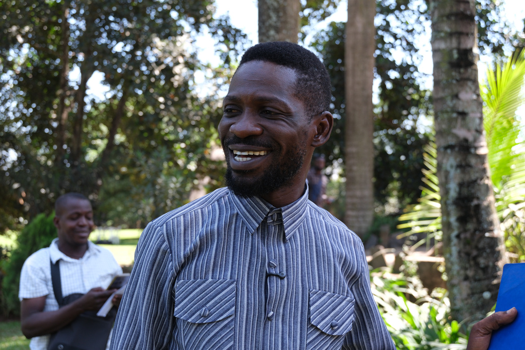 Uganda opposition presidential candidate Robert Kyagulanyi Ssentamu, known as Bobi Wine, speaks to journalists after the government ordered an internet shutdown at his home in Magere village, Kampala, Uganda, Wednesday, Jan. 14, 2026. (AP Photo/Hajarah Nalwadda)