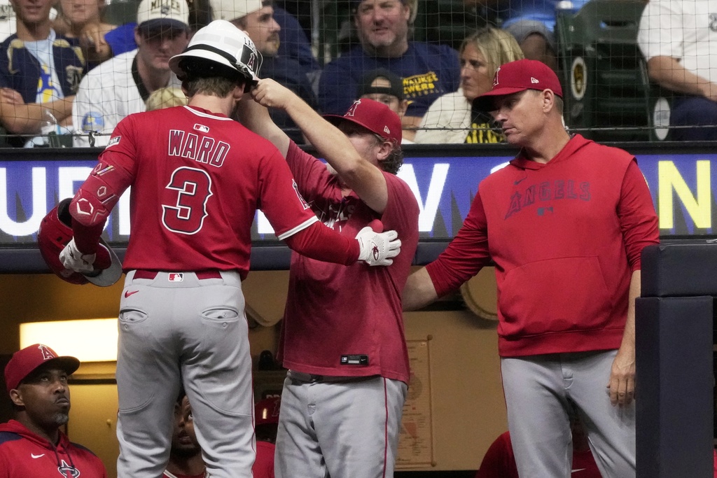 Los Angeles Angels' Taylor Ward is congratulated after hitting a home run during the fourth inning of a baseball game against the Milwaukee Brewers Wednesday, Sept. 17, 2025, in Milwaukee. (AP Photo/Morry Gash)