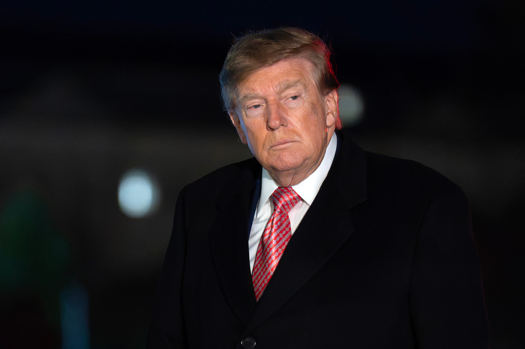 President Donald Trump walks on the South Lawn upon his arrival to the White House, Sunday, Oct. 18, 2026, in Washington. (AP Photo/Jose Luis Magana)