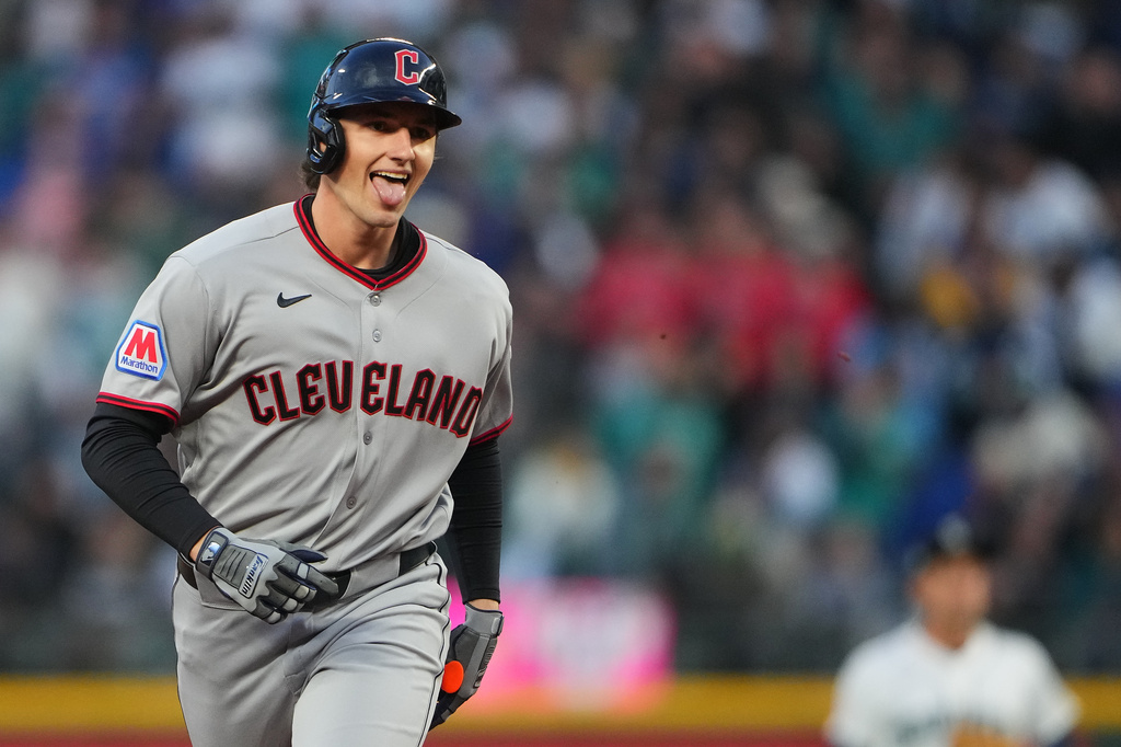 Cleveland Guardians' Chase DeLauter jogs the bases after hitting a solo home run against Seattle Mariners starting pitcher Logan Gilbert during the first inning of an opening-day baseball game, Thursday, March 26, 2026, in Seattle. (AP Photo/Lindsey Wasson)