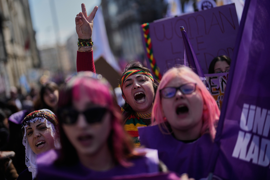 Women shout slogans as they march during a protest marking the International Women's Day, in Istanbul, Turkey, Sunday, March 8, 2026. (AP Photo/Khalil Hamra)