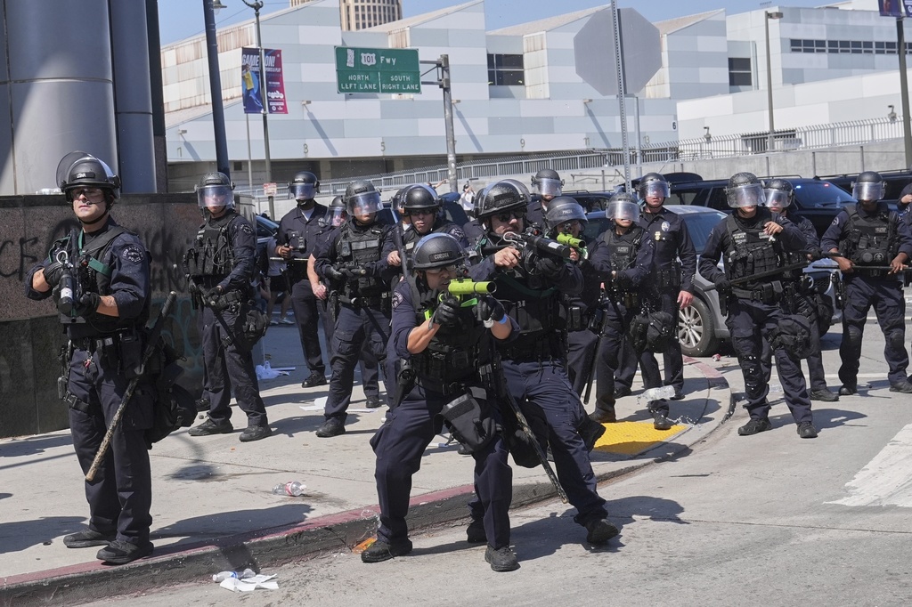 FILE - Police defend the Metropolitan Detention Center in downtown Los Angeles, June 8, 2025, following an immigration raid protest the previous day.(AP Photo/Jae Hong, File)