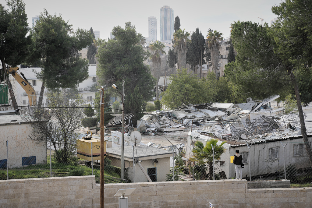 Israeli bulldozers demolish a UNRWA compound, belonging to the U.N. agency that assists Palestinian refugees, in east Jerusalem Tuesday, Jan. 20, 2026. (AP Photo/Mahmoud Illean)