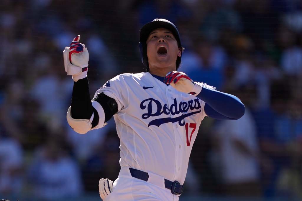 Los Angeles Dodgers' Shohei Ohtani yells as he loses his bat during the third inning of a baseball game against the San Diego Padres, Sunday, July 5, 2026, in Los Angeles. (AP Photo/Mark J. Terrill)