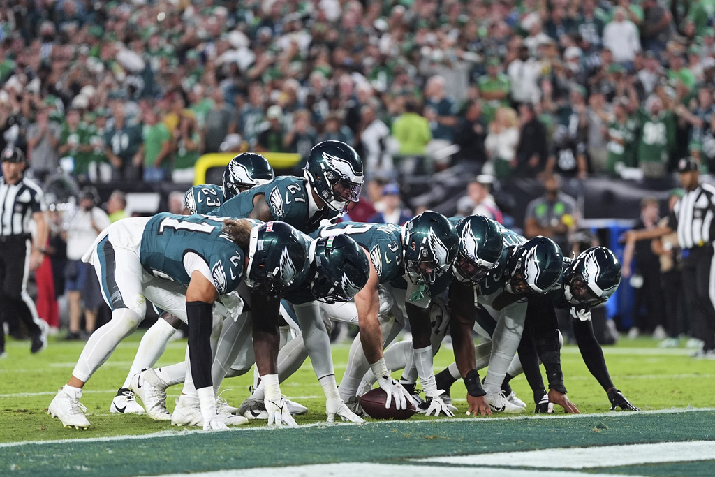 The Philadelphia Eagles defense celebrate after recovering a Dallas Cowboys fumble in the second half of an NFL football game Thursday, Sept. 4, 2025, in Philadelphia. (AP Photo/Matt Rourke)