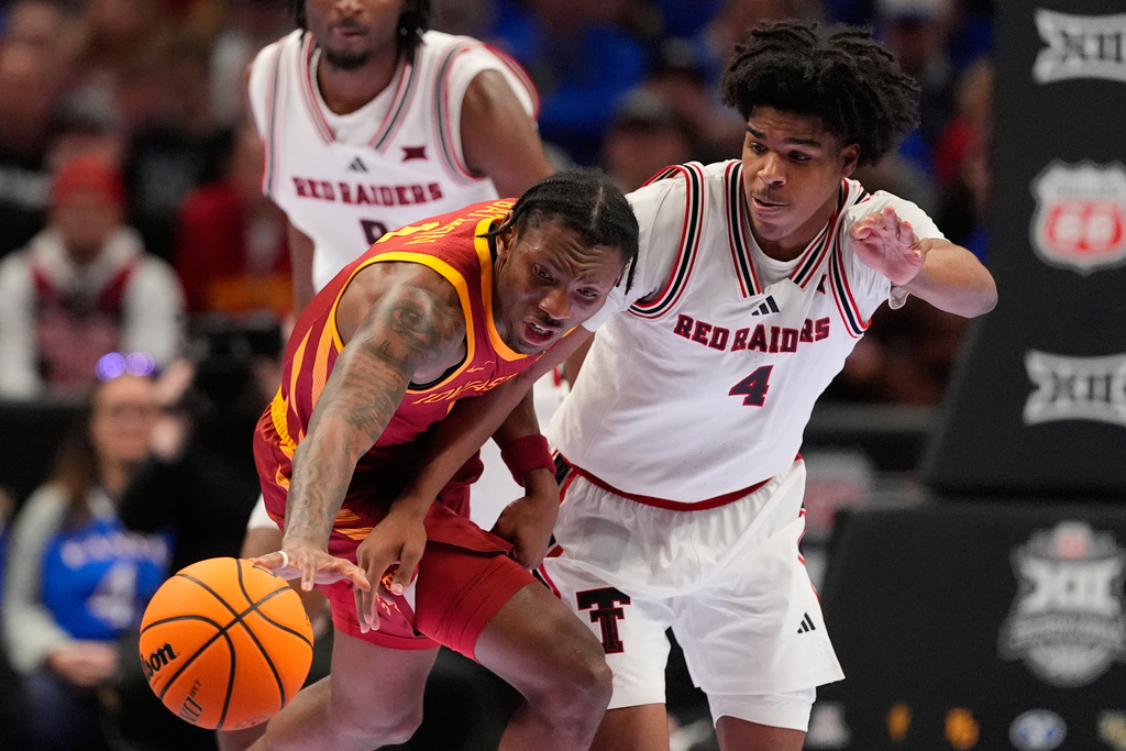 Iowa State's Jamarion Batemon, right, and Texas Tech's Christian Anderson (4) chase a loose ball during the second half of an NCAA college basketball game in the quarterfinal round of the Big 12 Conference tournament Thursday, March 12, 2026, in Kansas City, Mo. (AP Photo/Charlie Riedel)