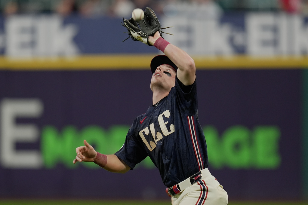Cleveland Guardians second baseman Travis Bazzana catches a fly ball hit for an out by Boston Red Sox's Isiah Kiner-Falefa in the seventh inning of a baseball game in Cleveland, Friday, May 29, 2026. (AP Photo/Sue Ogrocki)