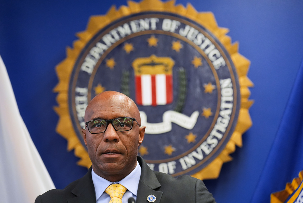 FBI Assistant Director in Charge Akil Davis announces developments on a terrorism investigation during a press conference Monday, Dec. 15, 2025, in Los Angeles. (AP Photo/Damian Dovarganes)