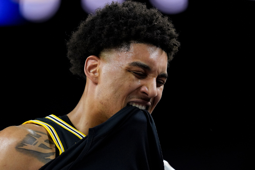 Michigan forward Yaxel Lendeborg reacts after an injury on the court during the first half of an NCAA college basketball tournament semifinal game against Arizona at the Final Four, Saturday, April 4, 2026, in Indianapolis. (AP Photo/Abbie Parr)
