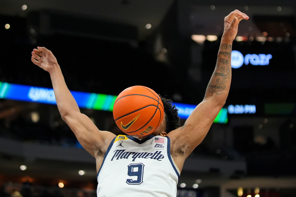 Marquette's Damarius Owens after dunking the ball during the first half of an NCAA college basketball game against St. John's, Wednesday, Feb. 18, 2026, in Milwaukee. (AP Photo/Aaron Gash)
