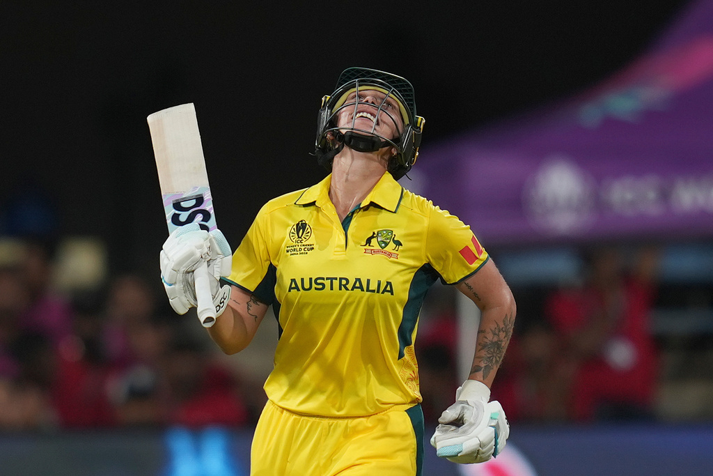 Australia's Ashleigh Gardner celebrates her century during the ICC Women's Cricket World Cup cricket match between New Zealand and Australia at Holkar Cricket Stadium in Indore, India, Wednesday, Oct. 1, 2025. (AP Photo/Rafiq Maqbool)