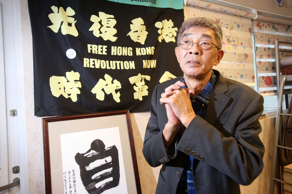 FILE- Lam Wing-kee, one of five shareholders and staff at the Causeway Bay Book shop in Hong Kong, thanks the press on the opening day of his shop in Taipei, Taiwan, Saturday, April 25, 2020. (AP Photo/Chiang Ying-ying, File)