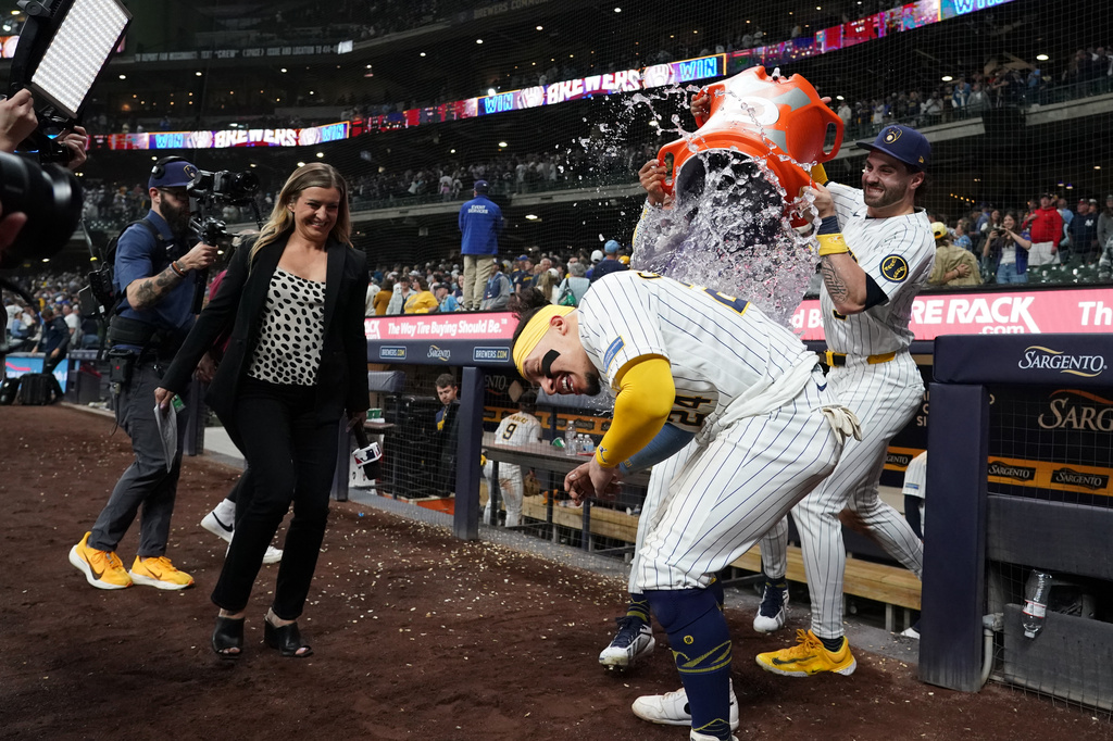 Milwaukee Brewers' William Contreras is doused by Jackson Chourio and Garrett Mitchell after a baseball game against the New York Yankees, Saturday, May 9, 2026, in Milwaukee. (AP Photo/Aaron Gash)