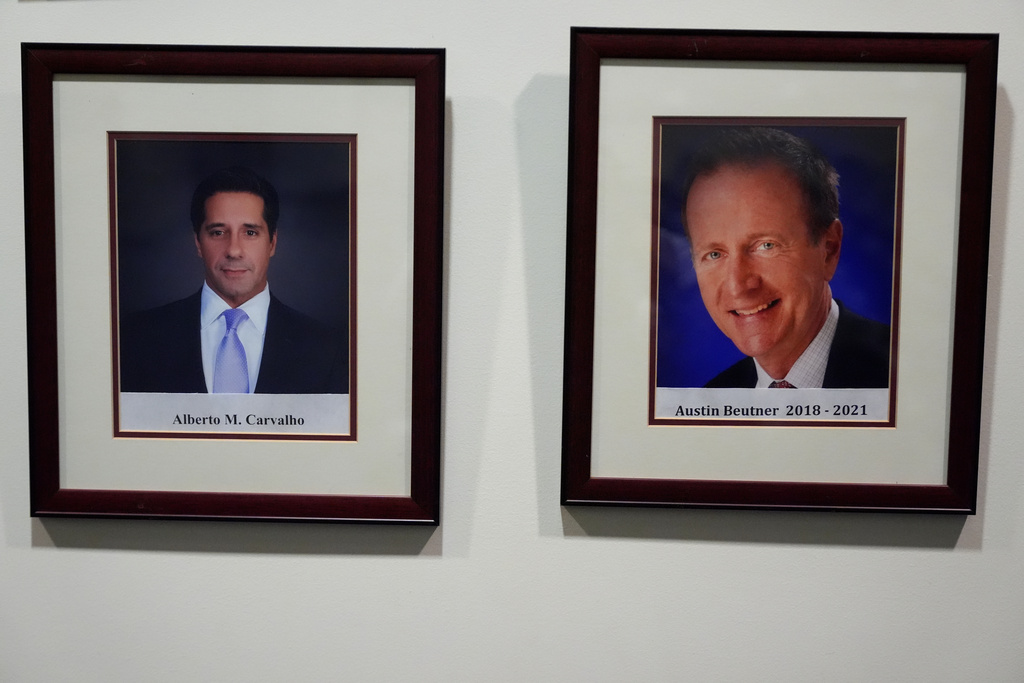 An official portrait of LAUSD Superintendents, Alberto Carvalho, left, and former Superintendent Austin Beutner, are displayed at Los Angeles Unified School District board room at LAUSD headquarters, Thursday, Feb. 26, 2026, in Los Angeles. (AP Photo/Damian Dovarganes)