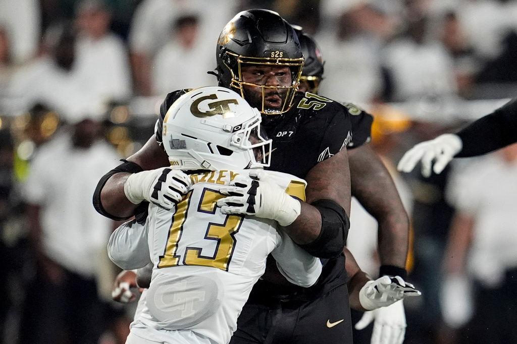 Colorado offensive lineman Chauncey Gooden (51) blocks Georgia Tech safety Savion Riley (13) during the first half of an NCAA college football game, Thursday, Sept. 3, 2026, in Atlanta. (AP Photo/Mike Stewart)
