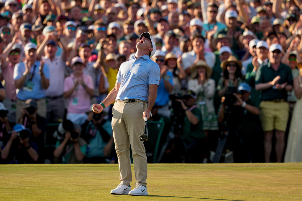 Rory McIlroy, of Northern Ireland, celebrates after winning the Masters golf tournament at the Augusta National Golf Club, Sunday, April 12, 2026, in Augusta, Ga. (AP Photo/Gerald Herbert)