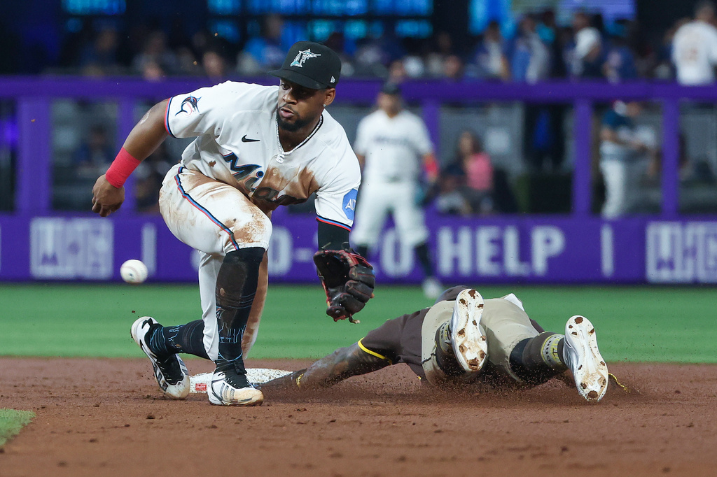 Miami Marlins shortstop Otto Lopez, left, waits for the throw as San Diego Padres' Luis Rengifo, right, steals second base during the second inning of a baseball game, Saturday, July 25, 2026, in Miami. (AP Photo/David Santiago)