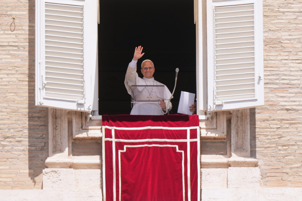 Pope Leo XIV delivers his blessing as he recites the Regina Coeli noon prayer from the window of his studio overlooking St. Peter's Square, at the Vatican, Sunday, May 17, 2026. (AP Photo/Andrew Medichini)