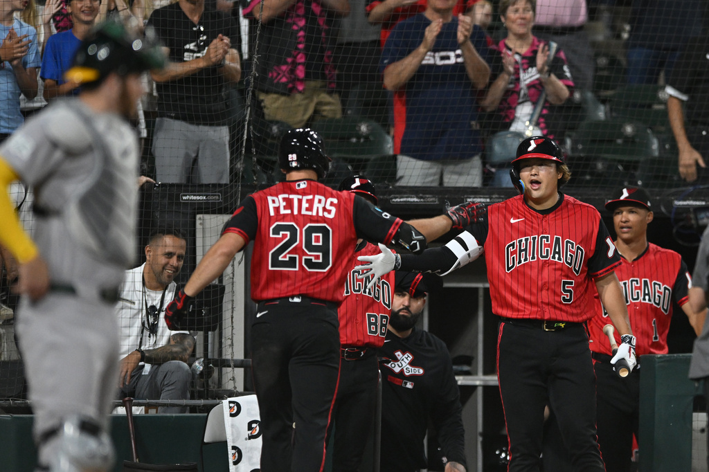 Chicago White Sox's Tristan Peters (29) celebrates with teammate Munetaka Murakami (5) at the dugout after hitting a two-run home run during the seventh inning of a baseball game against The Athletics in Chicago, Friday, July 10, 2026. (AP Photo/Paul Beaty)