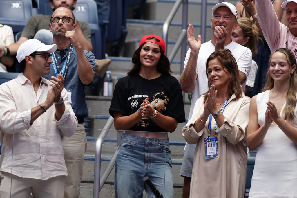 Soccer player Trinity Rodman, center, reacts after her boyfriend Ben Shelton, of the United States, lost the men's singles final of the U.S. Open tennis championships against Alexander Zverev, of Germany, Sunday, Sept. 13, 2026, in New York. (AP Photo/Adam Hunger)