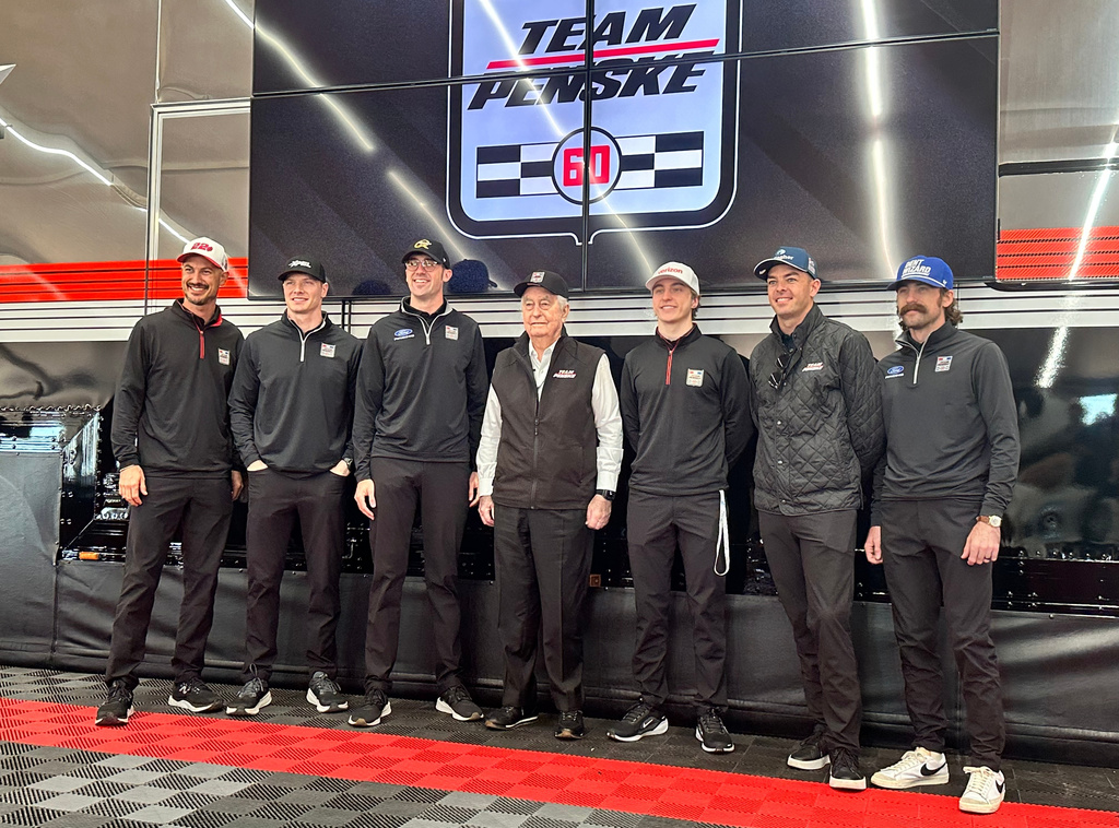 Team Penske pose for a photo as they celebrate its 60th season in motorsports on Friday, March 6, 2026 at Phoenix Raceway in Avondale, Arizona. L-R, Joey Logano, Josef Newgarden, Austin Cindric, Roger Penske, David Malukas, Scott McLauglin and Ryan Blaney. (AP Photo Jenna Fryer)