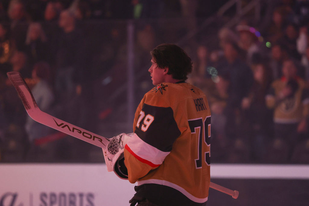 Vegas Golden Knights goaltender Carter Hart (79) stands for the National Anthem before an NHL hockey game against the Chicago Blackhawks Tuesday, Dec. 2, 2025, in Las Vegas. (AP Photo/Ian Maule)