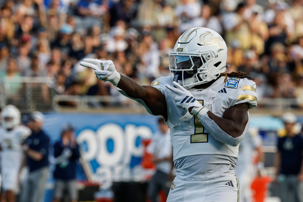 Georgia Tech running back Jamal Haynes (1) reacts after making a first down against BYU during the first half of the Pop-Tarts Bowl NCAA college football game, Saturday, Dec. 27, 2025, in Orlando, Fla. (AP Photo/Kevin Kolczynski)