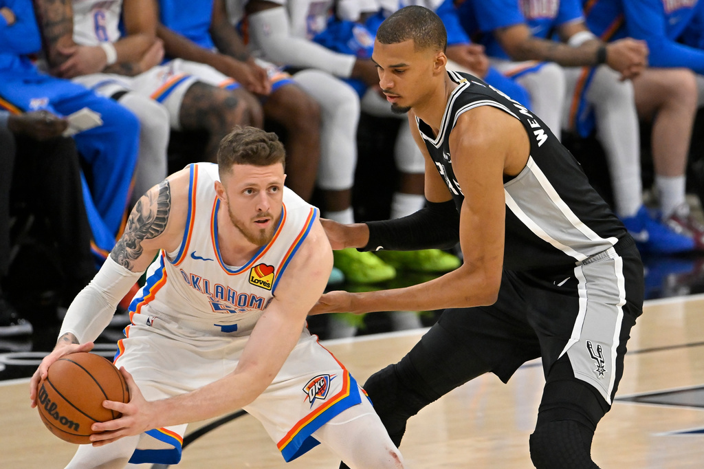 San Antonio Spurs forward Victor Wembanyama (1) defends against Oklahoma City Thunder center Isaiah Hartenstein (55) in the second half of Game 6 in the Western Conference finals NBA basketball playoffs series, Thursday, May 28, 2026, in San Antonio. (AP Photo/Darren Abate)