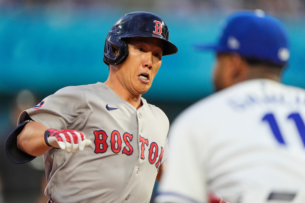 Boston Red Sox's Masataka Yoshida runs to third after hitting a triple during the fourth inning of a baseball game, Monday, May 18, 2026, in Kansas City, Mo. (AP Photo/Charlie Riedel)