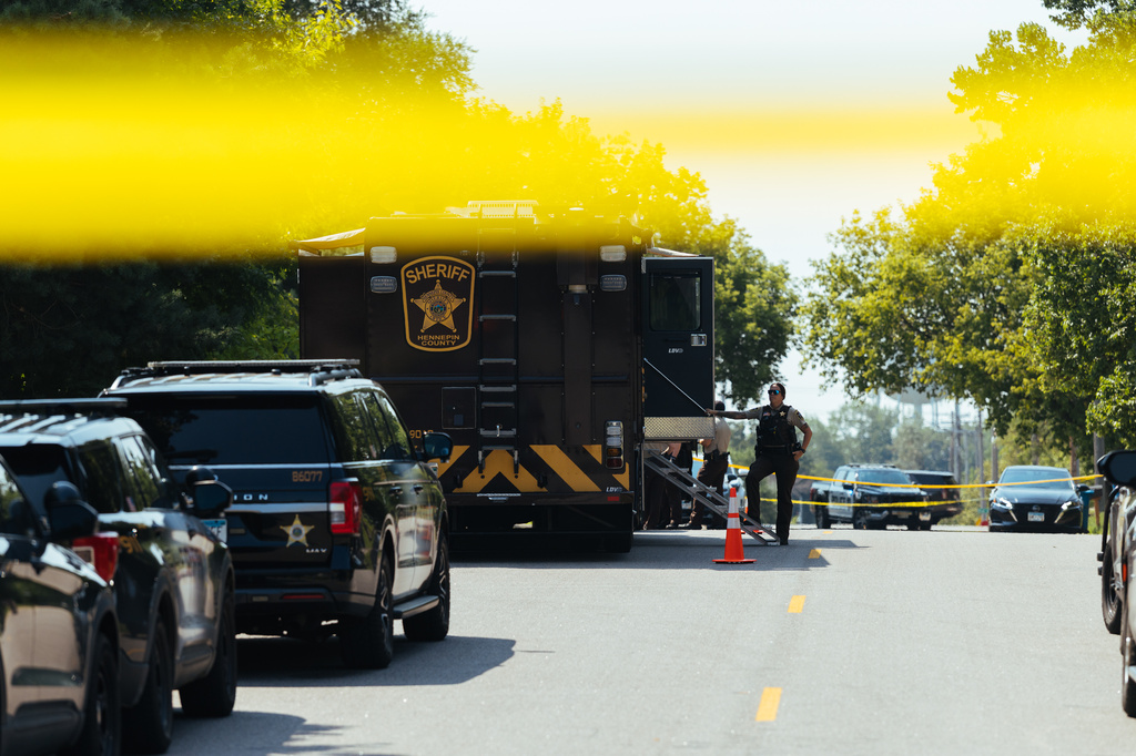 Law enforcement respond to a call at a home daycare, Wednesday, Aug. 12, 2026, in Hopkins, Minn. (AP Photo/Carly Danek)
