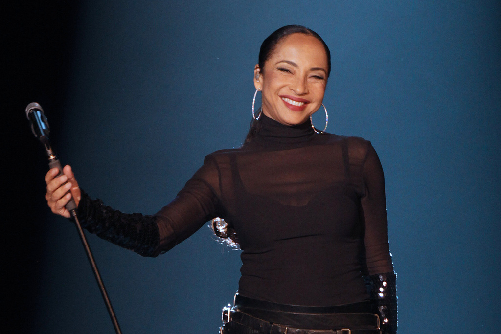 FILE - British singer Sade Adu performs during her "Soldiers of Love" concert in Sao Paulo, Brazil, on Oct. 20, 2011. (AP Photo/Andre Penner, File)