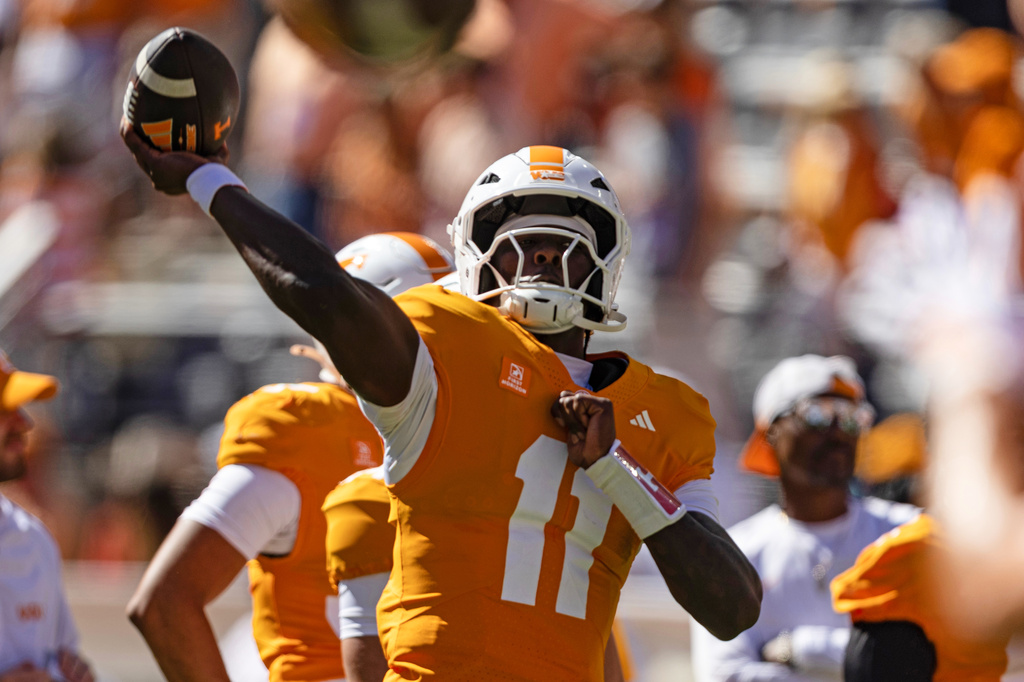Tennessee quarterback Faizon Brandon (11) warms up before an NCAA college football game against Texas, Saturday, Sept. 26, 2026, in Knoxville, Tenn. (AP Photo/Wade Payne)