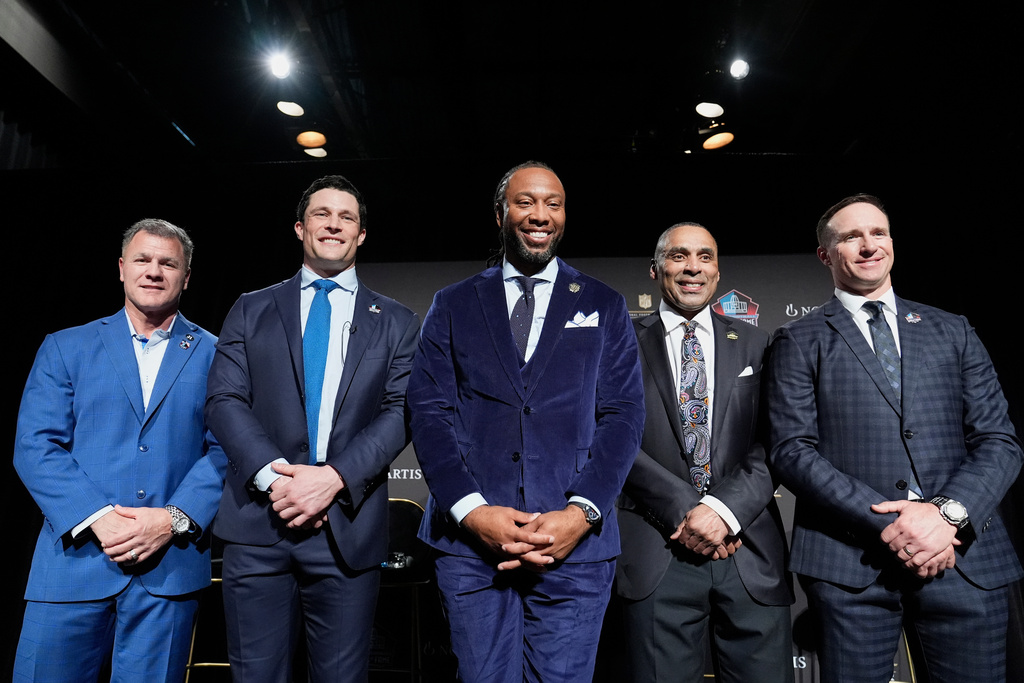Adam Vinatieri, from left, stands with Luke Kuechly, Larry Fitzgerald, Roger Craig and Drew Brees after being announced for the Pro Football Hall of Fame class of 2026 during football's NFL Honors award show in San Francisco, Thursday, Feb. 5, 2026. (AP Photo/Brynn Anderson)